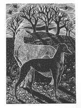 Load image into Gallery viewer, A black and white hand printed linocut art print depicting two greyhounds amidst snowdrops, with tree silhouettes in the background.
