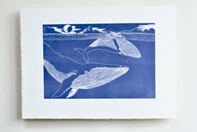 Load image into Gallery viewer, linocut Illustration of two whales in the ocean 
