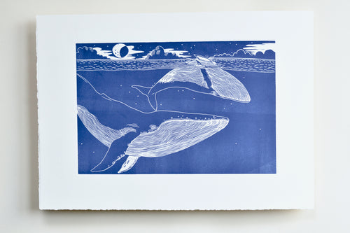 linocut Illustration of two whales in the ocean 